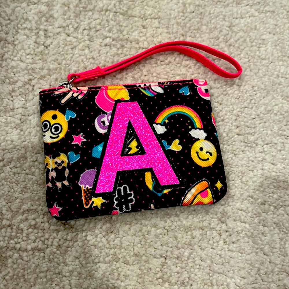 JUSTICE A WALLET PERFECT FOR GIRLS. ZIPPER WORKS GREAT!